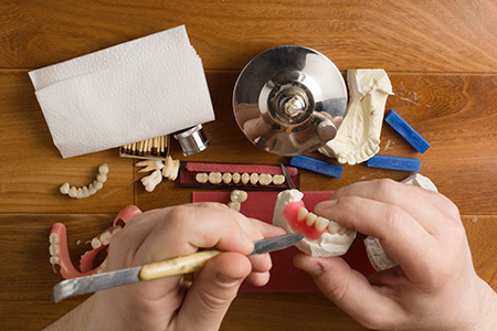 Dental technician working on teeth