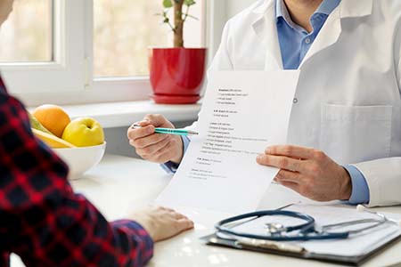 A dietitian showing a patient a new plan