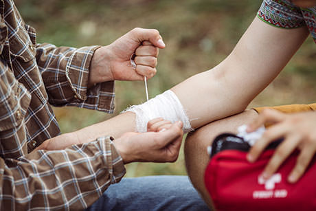 First aider helping someone