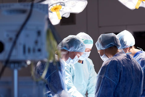 Surgeons working covered by medical malpractice insurance